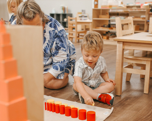 preschooler at sonnet montessori with cups